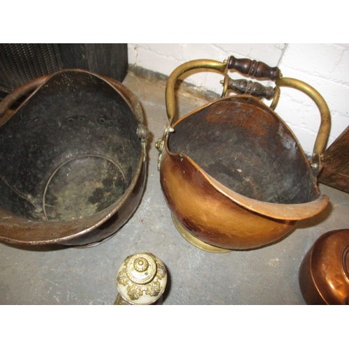 218 - A quantity of antique and later fireside items, to include copper coal hods a fender and flat irons,... 