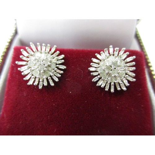 40 - A pair of gold and diamond daisy flower stud earrings, marked 10k in good pre-owned condition