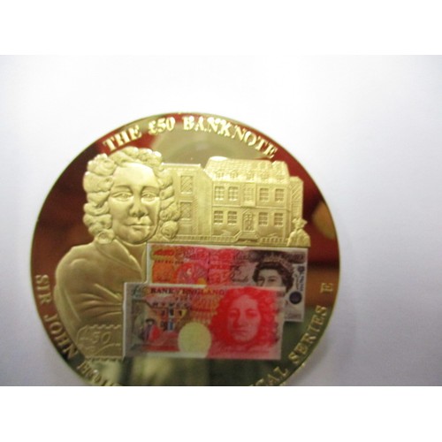 127 - A collectable metal commemorative medallion for the £50 bank note in plastic capsule and with certif... 