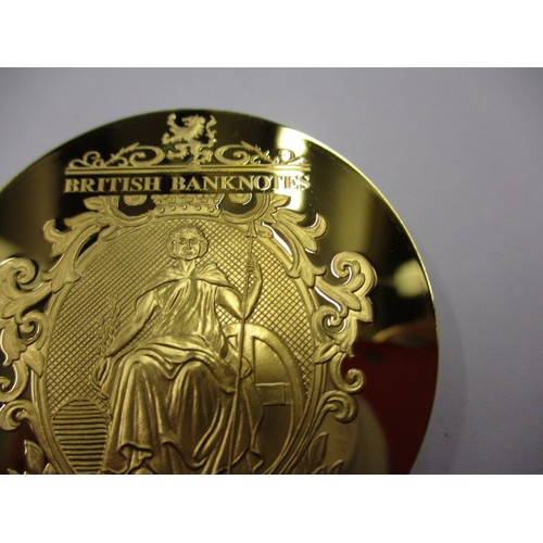 127 - A collectable metal commemorative medallion for the £50 bank note in plastic capsule and with certif... 