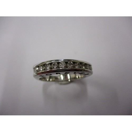 11 - An 18ct white gold and diamond half eternity ring, approx. size ‘P’ approx. weight 6.9g having 10 ch... 