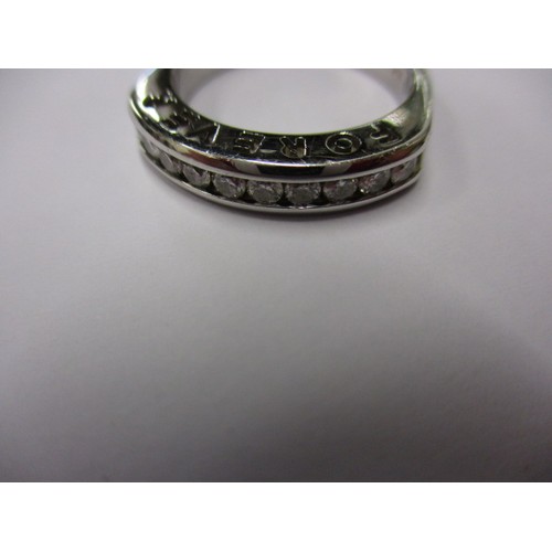 11 - An 18ct white gold and diamond half eternity ring, approx. size ‘P’ approx. weight 6.9g having 10 ch... 