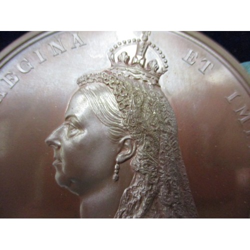 128 - A large bronze 1887 Victoria jubilee medallion in original box, in near mint condition, approx. dia ... 