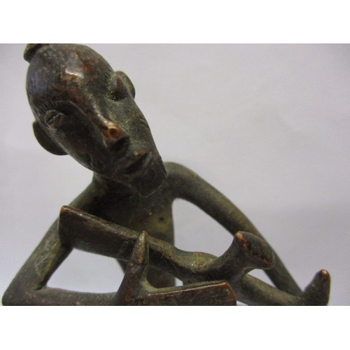 129 - A mid-20th century African bronze sculpture of a hunting man with his dog, approx. height 11cm