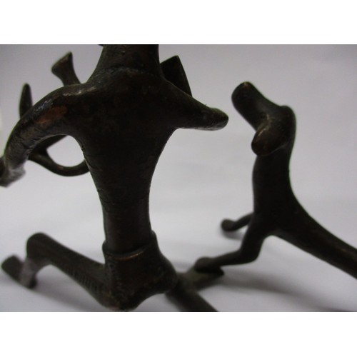 129 - A mid-20th century African bronze sculpture of a hunting man with his dog, approx. height 11cm