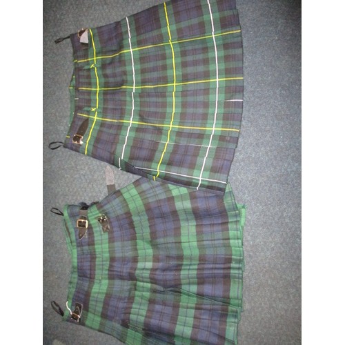 234 - Two Scottish Highland kilts, each in a different woven tartan, in good pre-owned condition