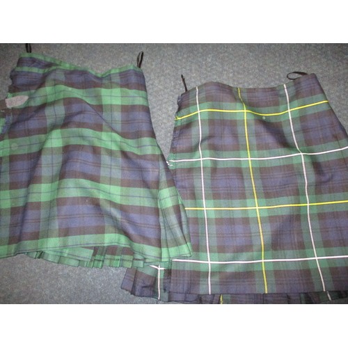 234 - Two Scottish Highland kilts, each in a different woven tartan, in good pre-owned condition