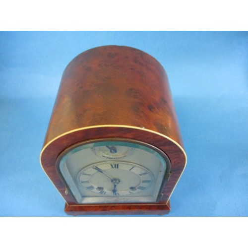 189 - An early 20th century burr walnut domed mantle clock, striking on a gong, in current working order w... 