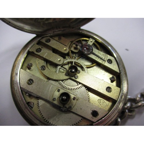 74 - A 935 silver cased pocket watch with white metal Albert chain, with key and in current working order