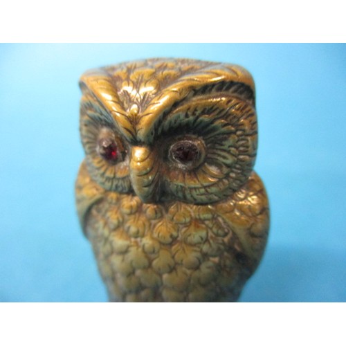 126 - A brass owl form cigarette lighter, probably a converted vesta case. Approximate height 5.5cm, with ... 