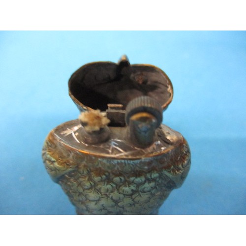 126 - A brass owl form cigarette lighter, probably a converted vesta case. Approximate height 5.5cm, with ... 