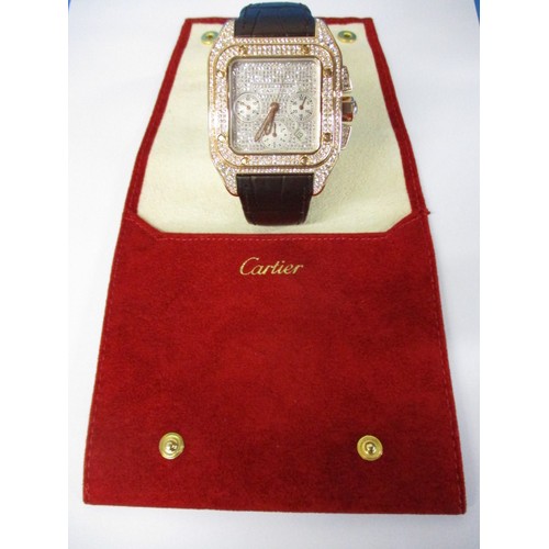 67 - A Cartier 18k pink gold automatic chronograph large Santos 100 watch model 2935, having numerous dia... 