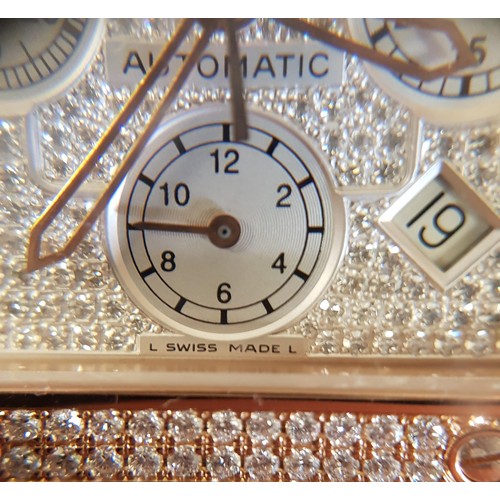 67 - A Cartier 18k pink gold automatic chronograph large Santos 100 watch model 2935, having numerous dia... 