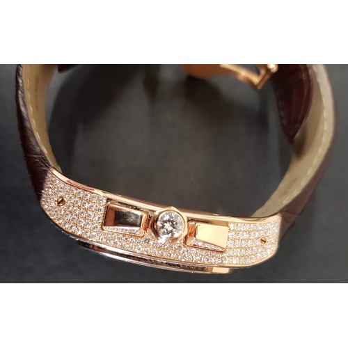 67 - A Cartier 18k pink gold automatic chronograph large Santos 100 watch model 2935, having numerous dia... 