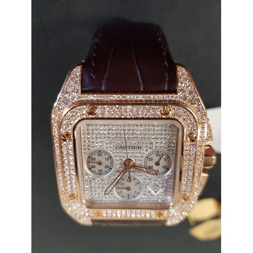 67 - A Cartier 18k pink gold automatic chronograph large Santos 100 watch model 2935, having numerous dia... 