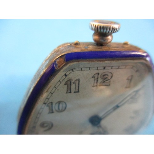 68 - A 1930’s art deco watch with silver and blue enamel body, of pendant form converting to stand. Initi... 