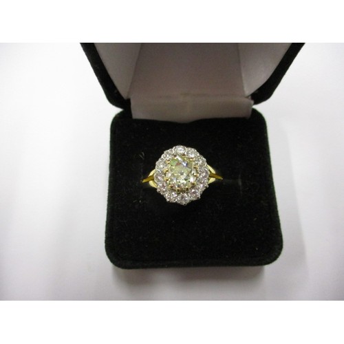 15 - An 18ct yellow gold diamond cluster ring, the central yellow stone measuring approx. 7.62mmx6.88mm a... 