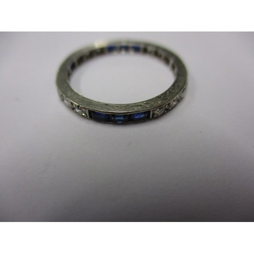 6 - A diamond and sapphire platinum eternity ring, approximate weight 1.7g, approximate ring size J ½ .I... 