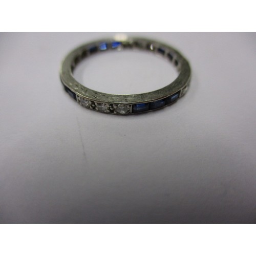6 - A diamond and sapphire platinum eternity ring, approximate weight 1.7g, approximate ring size J ½ .I... 