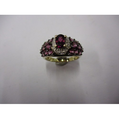 19 - A 9ct yellow gold, diamond and deep pink tourmaline dress ring, approx. ring size ‘M’ approx. weight... 