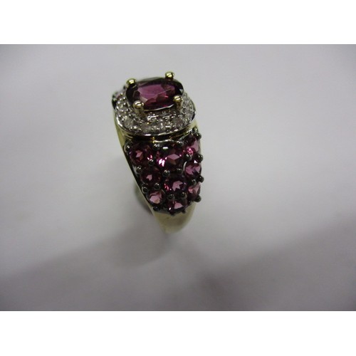 19 - A 9ct yellow gold, diamond and deep pink tourmaline dress ring, approx. ring size ‘M’ approx. weight... 