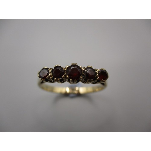1 - A 9ct yellow gold ring set with 4 garnets, approx. ring size ‘P’ approx. weight 2g in good pre-owned... 