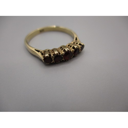 1 - A 9ct yellow gold ring set with 4 garnets, approx. ring size ‘P’ approx. weight 2g in good pre-owned... 