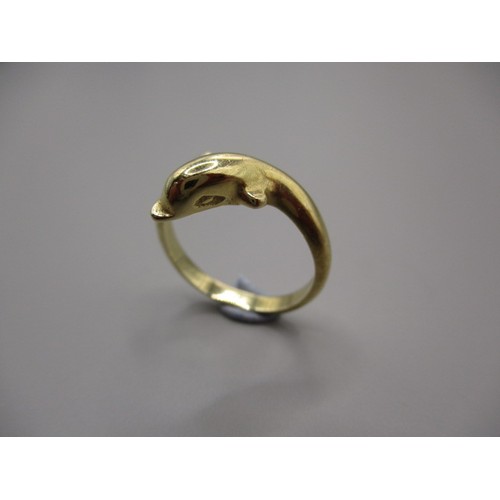 8 - A 9ct yellow gold dress ring in the form of a swimming dolphin, approx. ring size ‘J ½ ‘ approx. wei... 