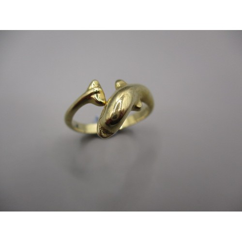 8 - A 9ct yellow gold dress ring in the form of a swimming dolphin, approx. ring size ‘J ½ ‘ approx. wei... 