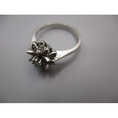 13 - An 18ct white gold daisy ring, approx. ring size ‘M’ approx. weight 3.5g in pre-owned condition with... 