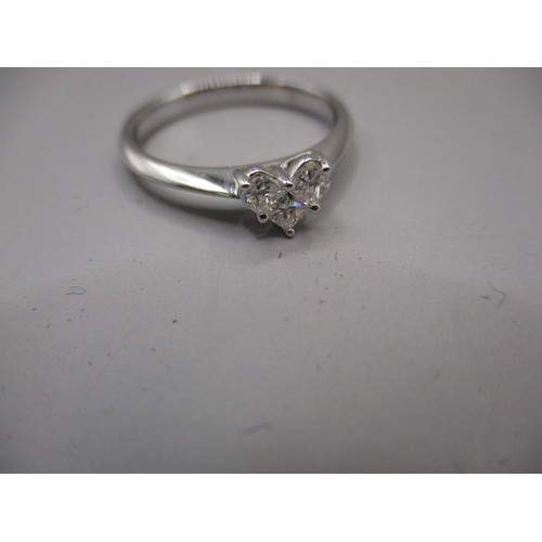 21 - An 18ct white gold 3 stone diamond, heart shaped ring. Approximate ring size O, approximate weight 3... 