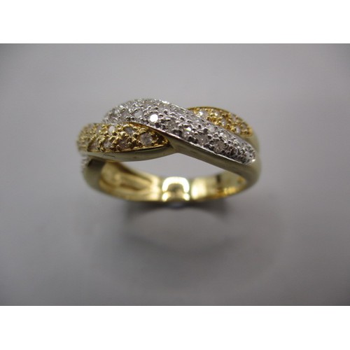 23 - A 585 yellow gold and diamond cross over ring, approx. ring size ‘N ½ ‘ approx. weight 3.8g
