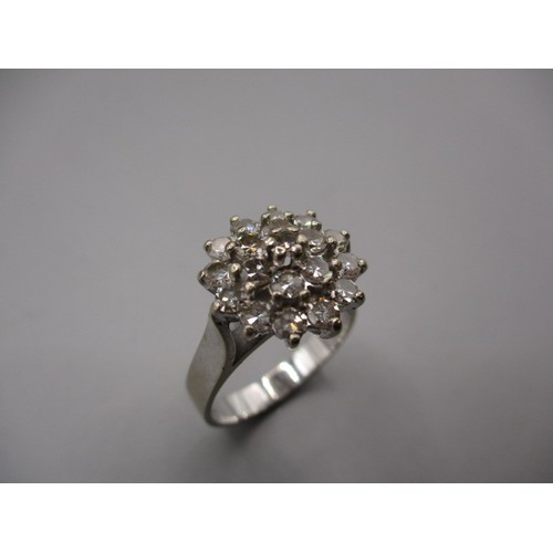 41 - An 18ct white gold and diamond daisy cluster ring, approx. ring size ‘O’ approx. weight 5.7g in good... 