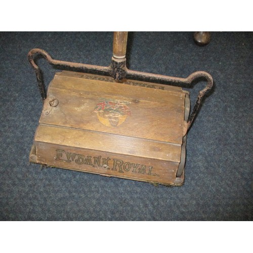 A vintage oak Ewbank Royal carpet sweeper, in working order, retaining most of the original transfers, having surface rust and age-related marks