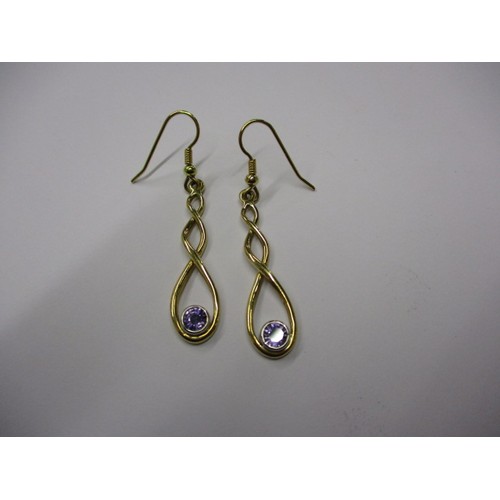 50 - A pair of bespoke made 18ct gold and purple sapphire drop earrings, each stone being approx. 0.88cwt... 