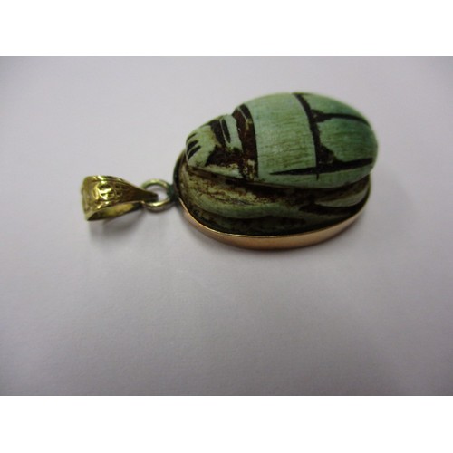 51 - A mid-20th century Egyptian Scarab beetle pendant with gold mount, in good pre-owned condition, appr... 