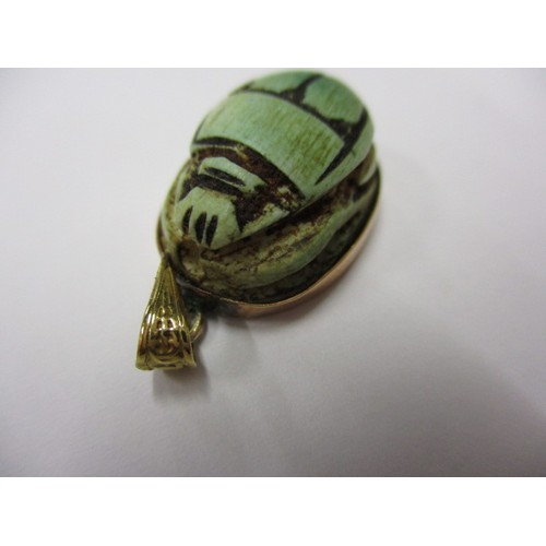 51 - A mid-20th century Egyptian Scarab beetle pendant with gold mount, in good pre-owned condition, appr... 