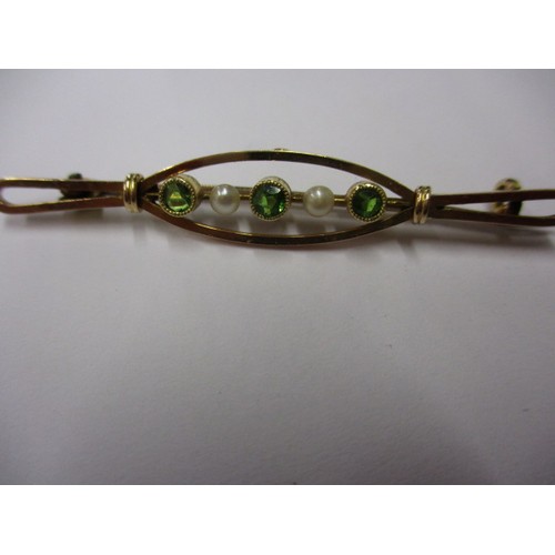 56 - An antique 15ct gold bar brooch, set with seed pearls and green stones, approx. weight 2.5g
