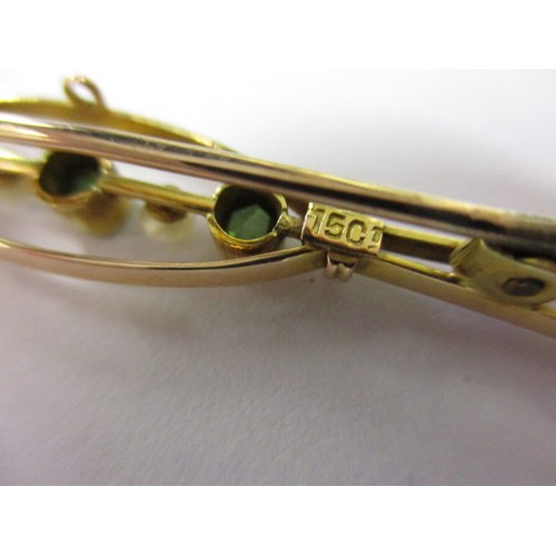 56 - An antique 15ct gold bar brooch, set with seed pearls and green stones, approx. weight 2.5g
