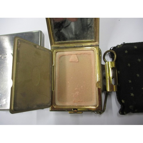 kigu cigarette case A vintage Kigu compact / cigarette case and a Prada cigarette case with  integral lighter, both in go