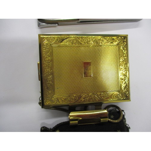 kigu cigarette case A vintage Kigu compact / cigarette case and a Prada cigarette case with  integral lighter, both in go