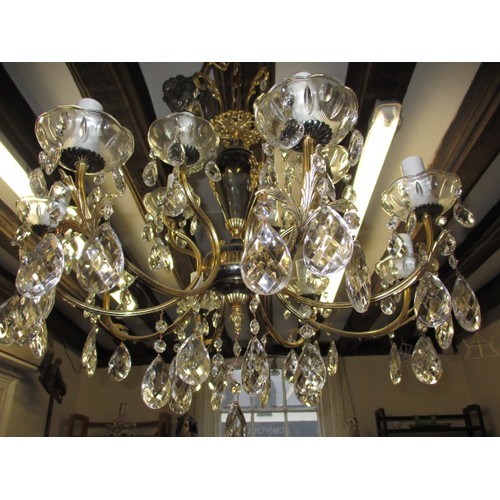 303 - A 12 lamp brass and lead crystal chandelier, approx. drop of body without chain 57cm approx. width 6... 