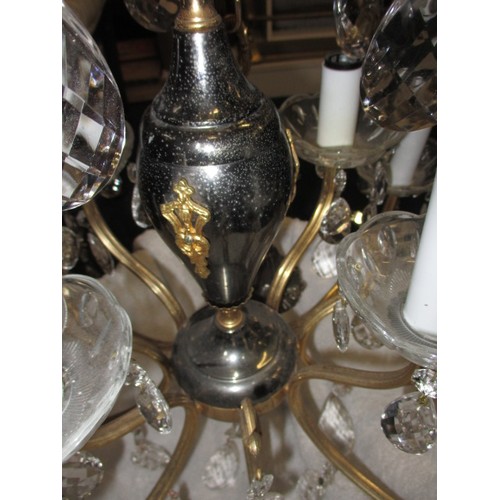 303 - A 12 lamp brass and lead crystal chandelier, approx. drop of body without chain 57cm approx. width 6... 