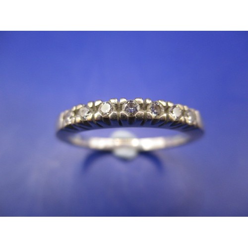 10 - An unmarked gold (tested to 18ct) 7 stone diamond ring, approx. weight 3.7g approx. ring size Q, hav... 