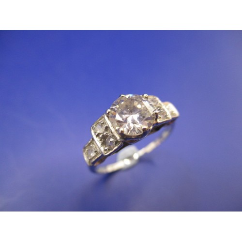 11 - An art deco platinum 7 stone diamond ring, approx. ring size K+, the central stone being a round old... 