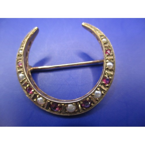 64 - An Edwardian 9ct yellow gold crescent moon brooch set with seed pearls and rubies? and a silver exam... 