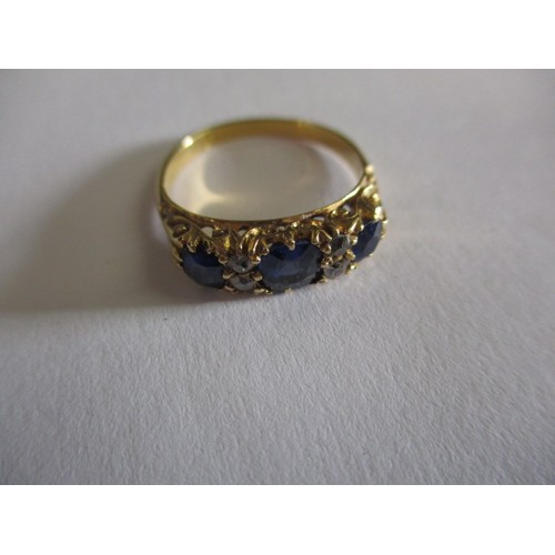 15 - An 18ct? yellow gold diamond and sapphire ring, approx. ring size J approx. weight 2.7g, marks worn ... 