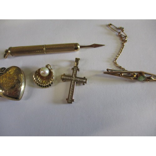 69 - A parcel of 9ct gold and yellow metal curios, approx. gross weight 16.2g, to include a tooth pick, b... 