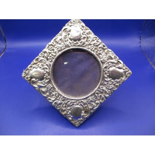 A late Victorian sterling silver easel type desk top photo frame, with Chester hallmark, in pre-owned condition with age-related marks