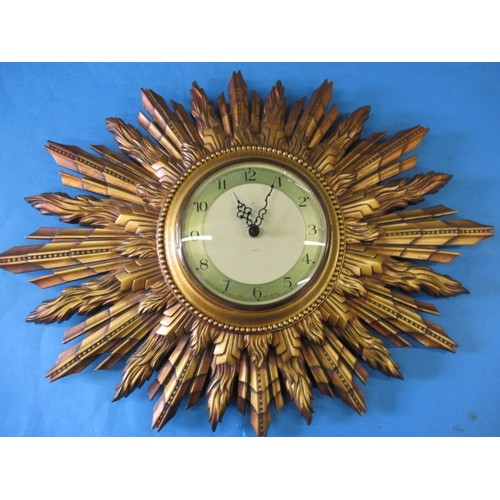 305 - A mid-20th century Sun burst wall clock, having had a replacement battery operated movement, 2 tips ... 